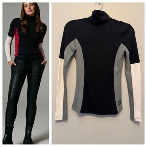 Alp n Rock Meken colorblock turtleneck in black, gray, and white.